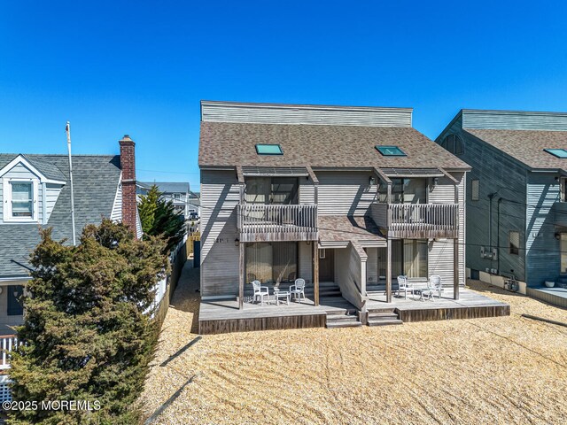 21 Brown Ave Unit 1, Lavallette, NJ 08735 - back of property featuring a balcony and a shingled roof