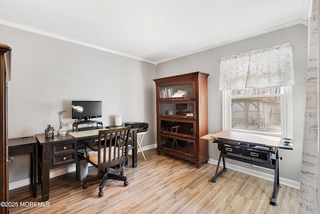 office area with baseboards, ornamental molding, and light wood-style floors