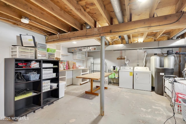 unfinished basement featuring separate washer and dryer