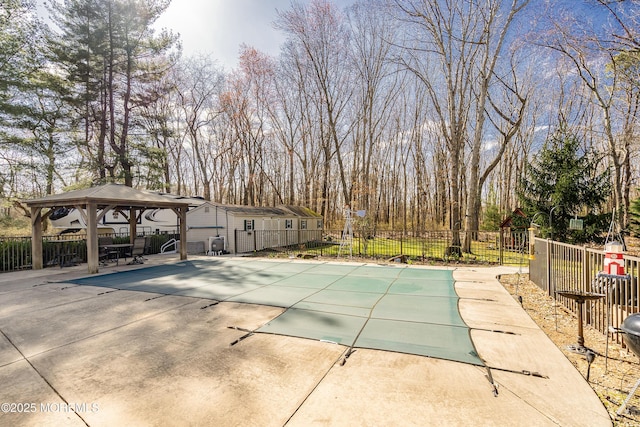 view of pool with a fenced in pool, a gazebo, fence, and a patio area