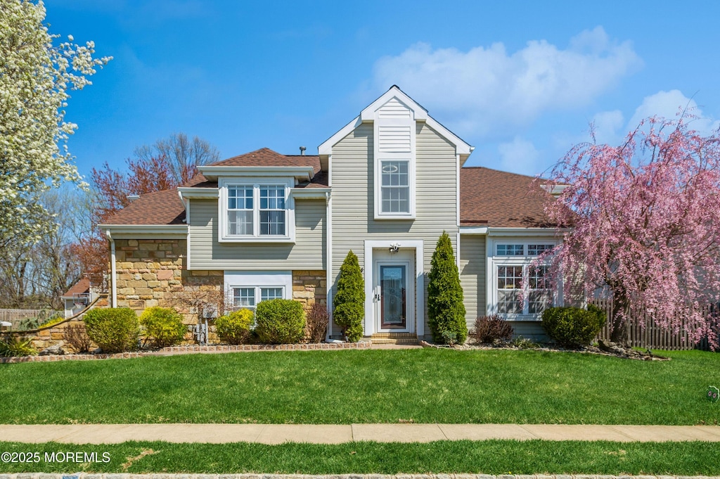 204 Kentucky Way, Freehold, NJ 07728 - view of front of property featuring roof with shingles, a front yard, entry steps, and stone siding