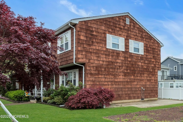 view of home's exterior with a yard