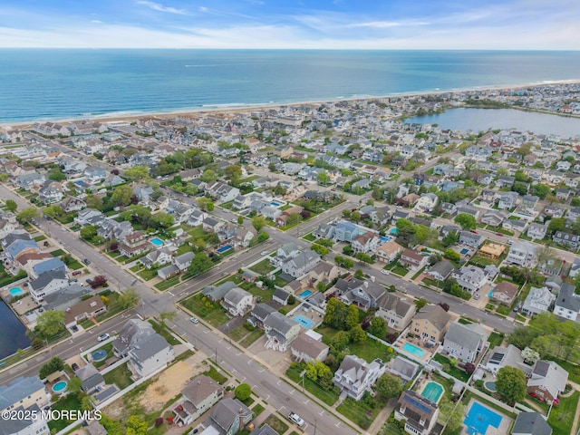 aerial view of property's location with a nearby body of water