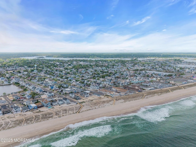 aerial overview of property's location with expansive coastline and nearby suburban area