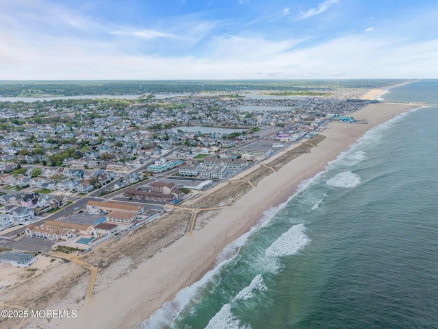 aerial view of property and surrounding area with expansive coastline