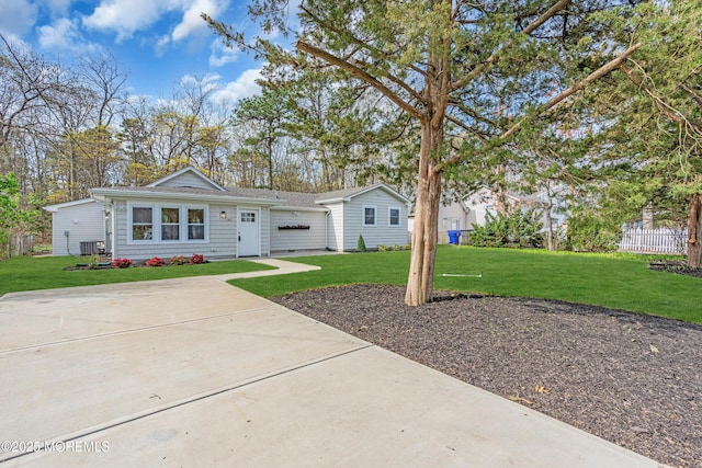view of front facade with a front lawn and a garage
