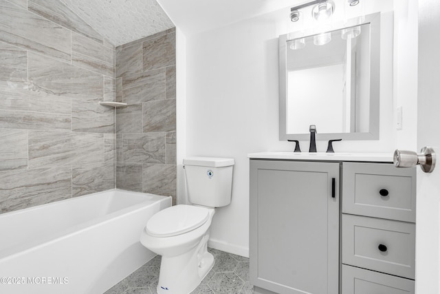 bathroom with vanity, toilet, baseboards, and shower / washtub combination