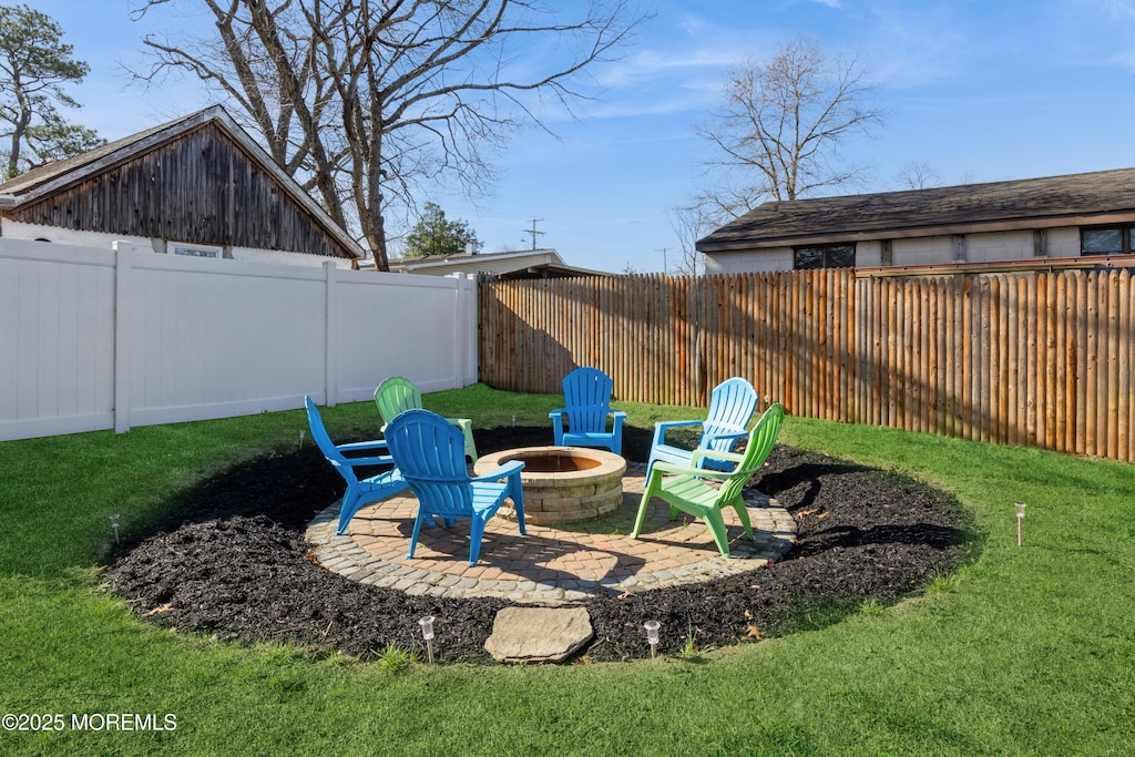 430 19th Ave, Brick, NJ 08724 - view of yard with a fenced backyard, a fire pit, and a patio