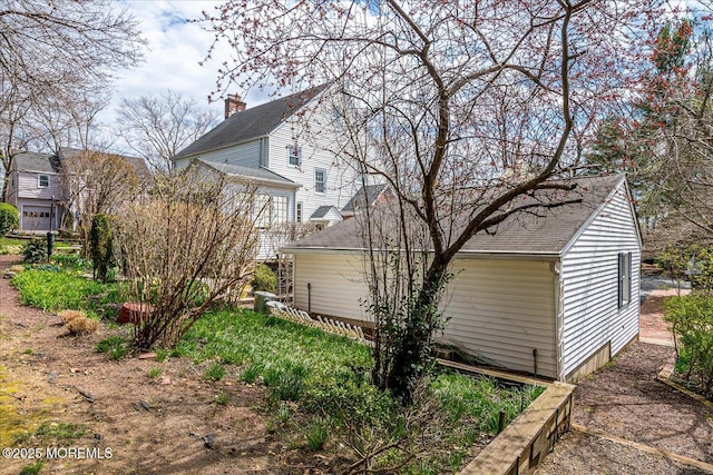 42 Pershing Ave, Sayreville Boro, NJ 08872 - view of side of home featuring a shingled roof