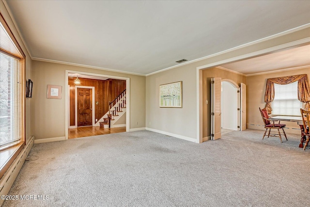 42 Pershing Ave, Sayreville Boro, NJ 08872 - carpeted empty room featuring crown molding, stairs, healthy amount of natural light, arched walkways, and a baseboard radiator