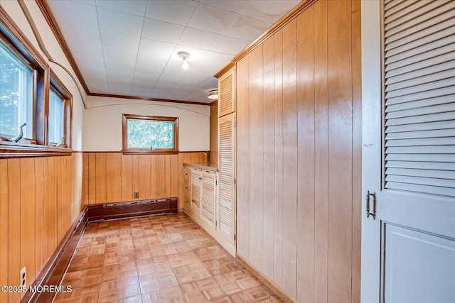 42 Pershing Ave, Sayreville Boro, NJ 08872 - unfurnished room with wooden walls, ornamental molding, and a wainscoted wall
