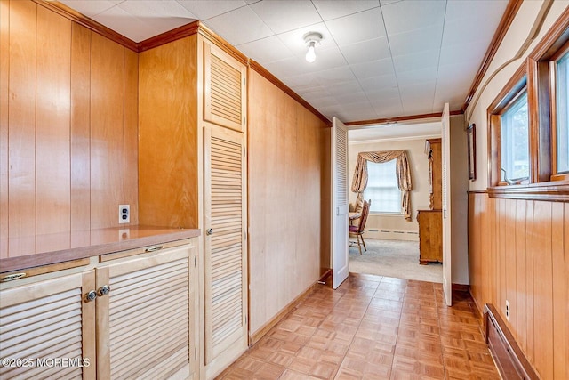 42 Pershing Ave, Sayreville Boro, NJ 08872 - hall with ornamental molding, wood walls, and a baseboard heating unit
