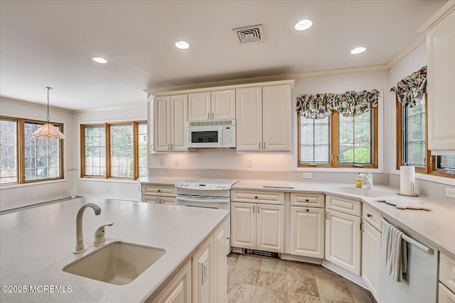 42 Pershing Ave, Sayreville Boro, NJ 08872 - kitchen with white appliances, recessed lighting, light countertops, decorative light fixtures, and ornamental molding
