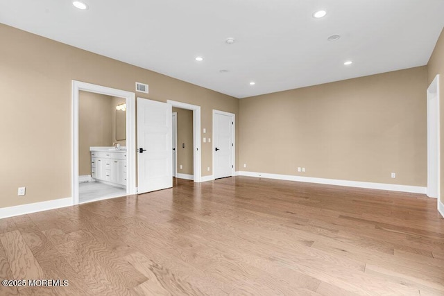 102 Ocean Ave, Monmouth Beach, NJ 07750 - spare room with visible vents, baseboards, a sink, recessed lighting, and light wood-style flooring