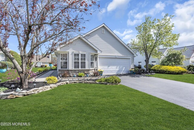 ranch-style house with a front lawn, aphalt driveway, stone siding, and a garage