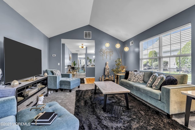 living room with lofted ceiling, visible vents, and carpet floors