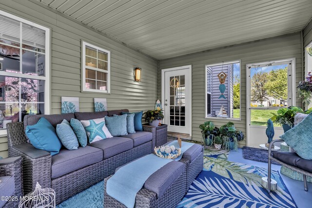 sunroom with an outdoor hangout area