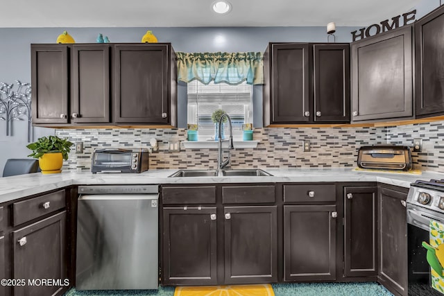 kitchen with dark brown cabinets, stainless steel appliances, light countertops, and a sink