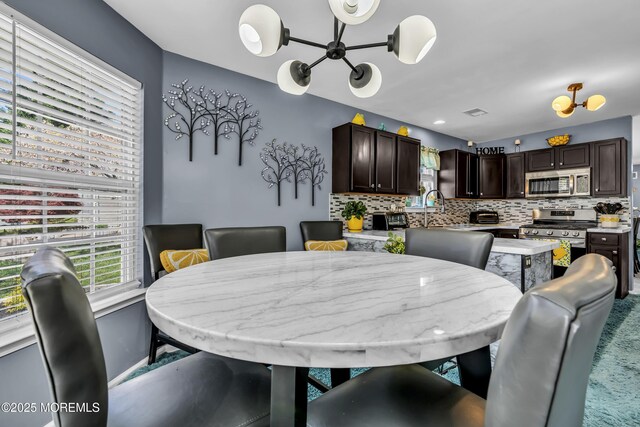 dining area featuring a chandelier
