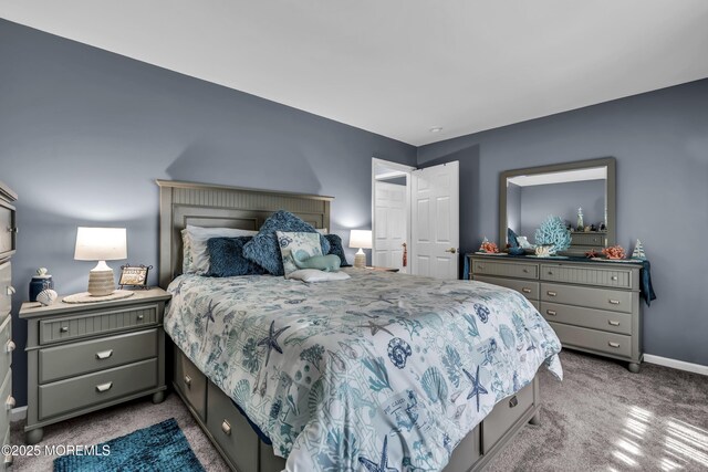 carpeted bedroom featuring baseboards