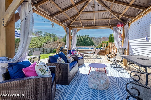 view of patio / terrace featuring a gazebo, fence, and an outdoor hangout area