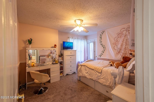 carpeted bedroom featuring a textured ceiling and a ceiling fan