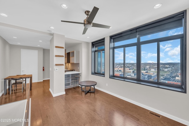601 Bangs Ave Unit 1107, Asbury Park, NJ 07712 - living area with wood finished floors, ceiling fan, baseboards, visible vents, and recessed lighting