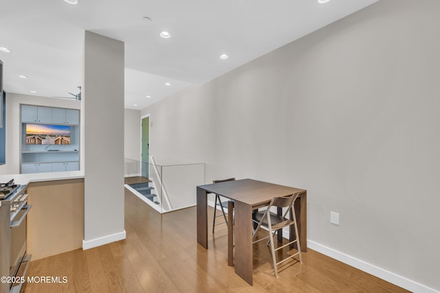 601 Bangs Ave Unit 1107, Asbury Park, NJ 07712 - dining room with baseboards, recessed lighting, light wood-style floors, and stairway