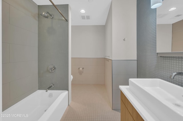 601 Bangs Ave Unit 1107, Asbury Park, NJ 07712 - bathroom with vanity,  shower combination, tile walls, tile patterned flooring, and visible vents