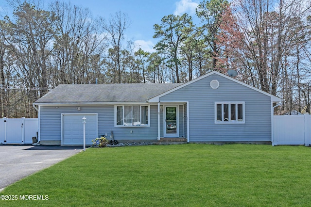 single story home featuring aphalt driveway, a garage, fence, and a gate