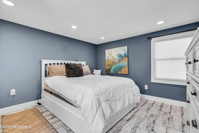 bedroom featuring baseboards and recessed lighting