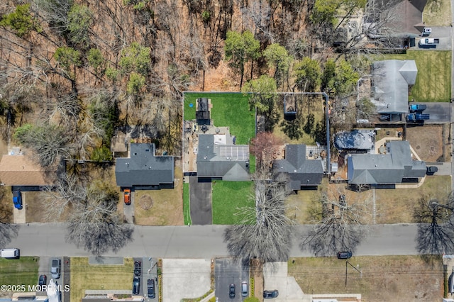 birds eye view of property with a residential view