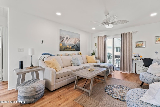living room featuring light wood-type flooring, recessed lighting, and a ceiling fan