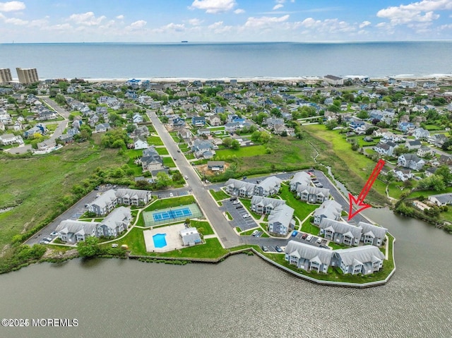 aerial view featuring a water view and a residential view