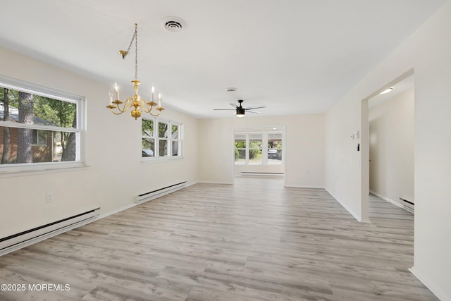 20 Lexington Dr Unit B, Whiting, NJ 08759 - spare room featuring baseboard heating, a chandelier, wood finished floors, and ceiling fan