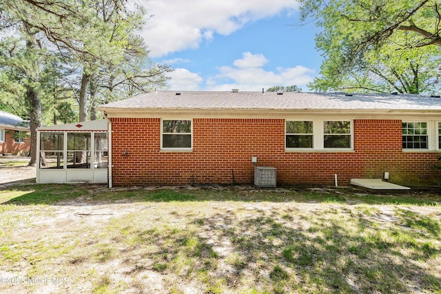 20 Lexington Dr Unit B, Whiting, NJ 08759 - back of property with a sunroom, central AC, brick siding, and a shingled roof