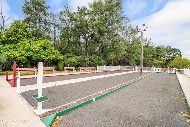 20 Lexington Dr Unit B, Whiting, NJ 08759 - view of community with a game area, fence, and view of wooded area