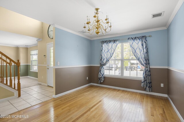 4 Frankies Ln, Toms River, NJ 08753 - unfurnished room with healthy amount of natural light, hardwood / wood-style flooring, baseboards, a chandelier, and ornamental molding