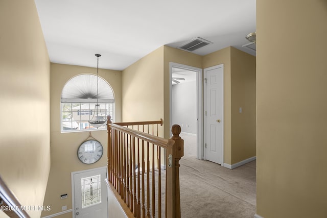 4 Frankies Ln, Toms River, NJ 08753 - hallway featuring carpet, an upstairs landing, baseboards, and a chandelier