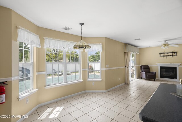 4 Frankies Ln, Toms River, NJ 08753 - unfurnished living room with healthy amount of natural light, a ceiling fan, and light tile patterned floors