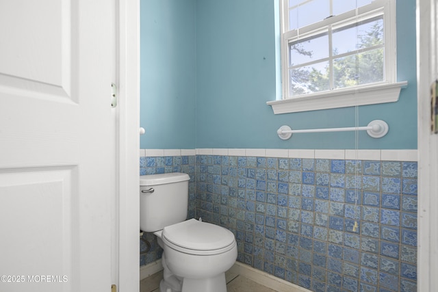4 Frankies Ln, Toms River, NJ 08753 - bathroom featuring tile walls, toilet, and a wainscoted wall