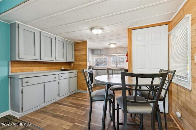 212 Roberts Rd, Toms River, NJ 08755 - dining room featuring wood walls and dark wood finished floors
