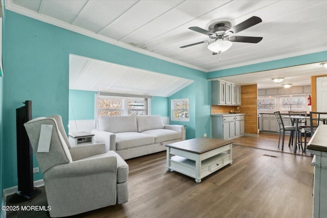 212 Roberts Rd, Toms River, NJ 08755 - living room with wooden walls, a ceiling fan, ornamental molding, and wood finished floors
