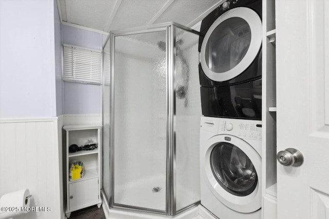 212 Roberts Rd, Toms River, NJ 08755 - bathroom with stacked washer / dryer, wainscoting, and a shower stall