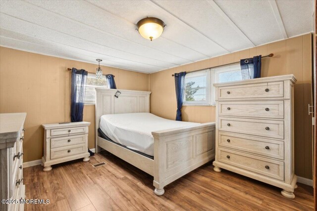 212 Roberts Rd, Toms River, NJ 08755 - bedroom featuring multiple windows and wood finished floors