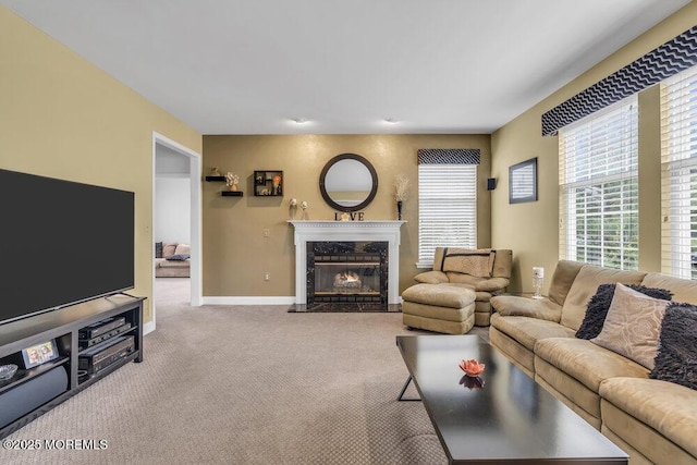 carpeted living room with baseboards and a premium fireplace