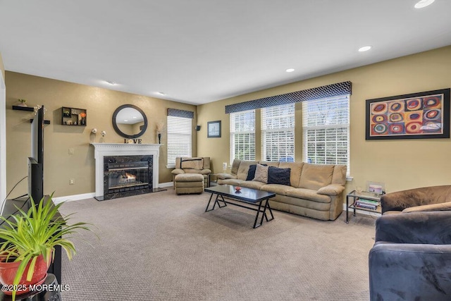 living room with recessed lighting, carpet flooring, baseboards, and a premium fireplace