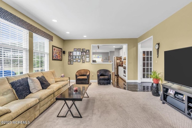 living area with recessed lighting, baseboards, and carpet floors