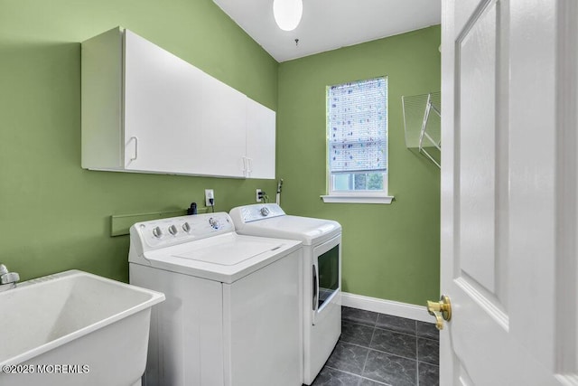 laundry area featuring a sink, independent washer and dryer, cabinet space, and baseboards
