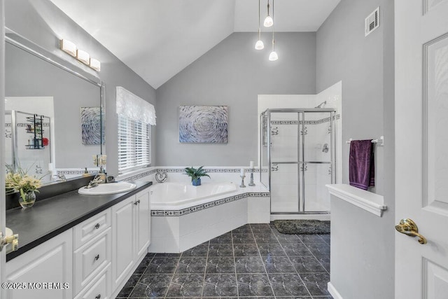 full bath featuring a shower stall, a bath, vanity, vaulted ceiling, and visible vents